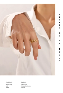 Detailed view of an 18K gold plated stainless steel chain ring on a finger