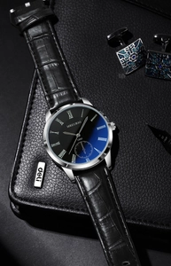 Macro view of blue gradient watch dial with roman numerals on black leather background