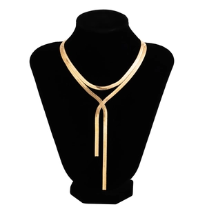 Close-up of golden snake chain necklace with Y-shaped drop design on black neck bust