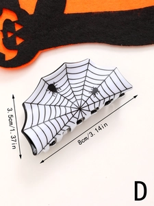 Detail view of a large white Halloween hair claw clip with spider web design and 8cm dimensions