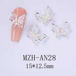 Macro shot of laser butterfly nail charms with iridescent crystal for manicure