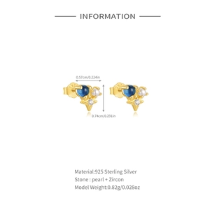 Close-up of S925 silver gold-plated stud earring with blue zircon and pearl detail