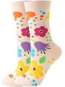 Detailed view of beige crew socks with colorful floral patterns and polka dots knit fabric
