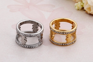 Detailed view of silver and gold hollow girl silhouette rings with micro zircon inlay