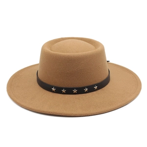 Detail of camel wool felt hat with black leather band and silver star rivets