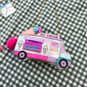 Detailed top view of ice cream truck crossbody bag with pink pompom and chain strap