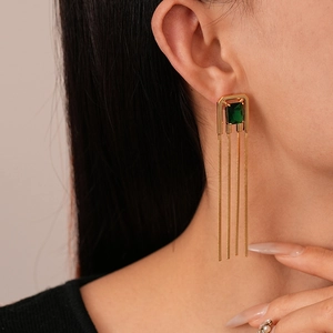 Elegant gold vintage earrings with emerald square stone and long metal tassels