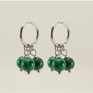 Detail of silver stainless steel hoop earrings with three green malachite texture beads