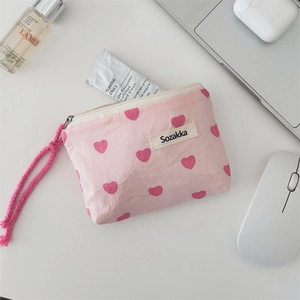 Close-up of pink canvas tote with heart print and durable Sozakka woven label
