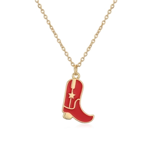 Fashionable gold necklace with a red cowboy boot pendant and star detail on white background