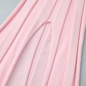 Close-up of pink ribbed knit fabric texture and high-quality elastic slit detail