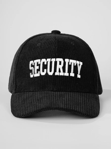 Detailed view of white SECURITY embroidery on black corduroy baseball cap texture