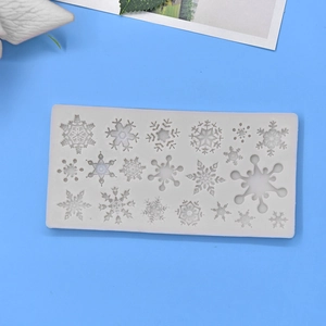 White silicone snowflake mold with 18 cavities for DIY baking and festive cake decorating