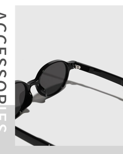 Detailed macro view of durable metal hinges on vintage black oval sunglasses frame