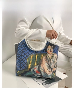 Artistic oil painting tote bag featuring a portrait print on canvas carried by a model