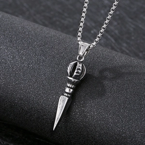 Detailed view of silver Vajra pestle pendant on box chain with polished metal finish