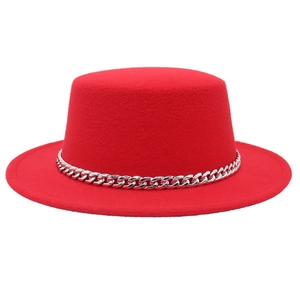 Classic red flat top wool hat with silver chain band decoration on a white background