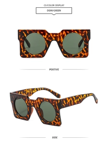 Detail view of square demi frames and green lenses for stylish geometric sunglasses