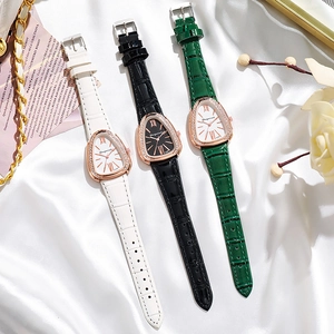 Close-up of three snake-head shaped ladies' watches with diamond bezels and leather straps