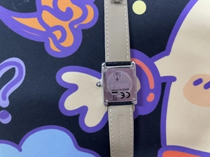 Close-up of SAMDA watch stainless steel backplate with leather strap and engraving