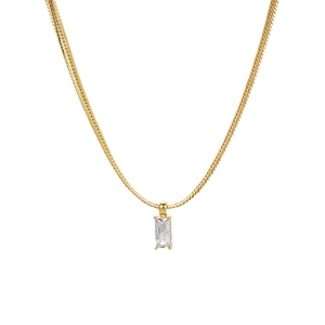 Detailed close-up of a rectangular clear zircon pendant on a golden snake bone chain
