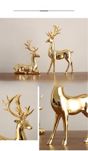 Detail of luxury electroplated gold elk statues with a high-gloss mirror finish surface