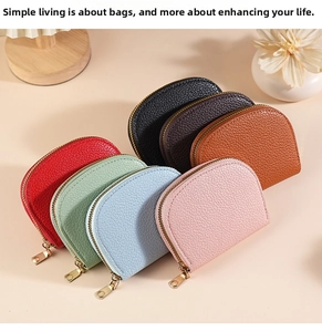 Detailed pile of colorful half-moon coin purses with textured faux leather and gold zippers