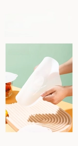 Close-up showing the high flexibility of a durable food-grade silicone microwave cover