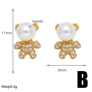 Detail view of gold bear earrings with pearls and zircons showing 11x9mm dimensions