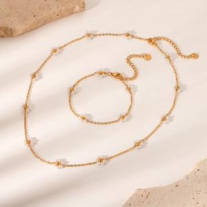Elegante set di collana e bracciale in acciaio inossidabile dorato con margherite
