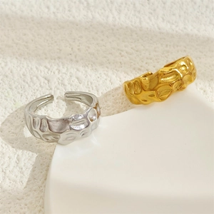 Minimalist hammered stainless steel open rings in gold and silver finish on stand