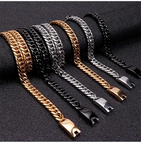 Detail of Cuban link chains in gold, silver, and black metal finishes on display stand