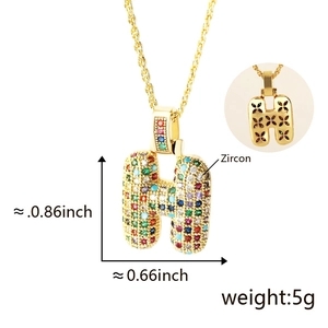 Detailed view of gold letter H pendant with colorful zircon stones and dimensions