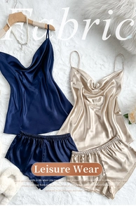 Flat lay of satin silk camisole and shorts pajama set with a soft luxurious texture