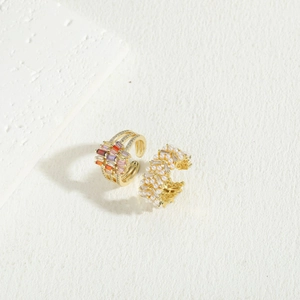 Luxurious 14K gold plated rings with colorful zircon gems and pearls on white background