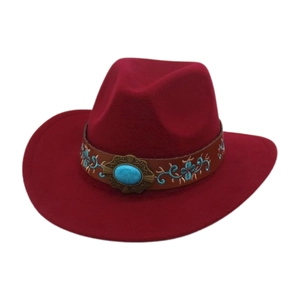 Detail of red felt cowboy hat featuring turquoise stone and floral embroidery on band