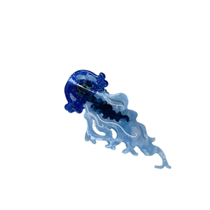 Blue translucent jellyfish hair claw clip with glitter accents and white ocean patterns