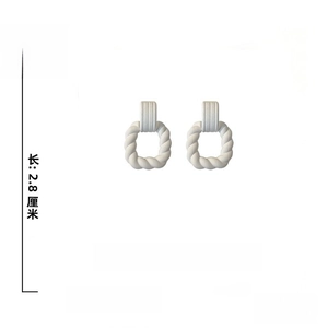 Macro view of white acrylic twisted square earrings with S925 silver needle dimensions