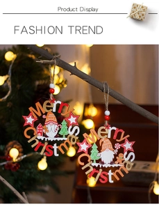 Detail of wooden Merry Christmas gnomes ornaments with ginger man and beads for tree decor