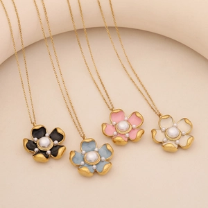 Golden flower pendant necklaces with pearls in black, blue, pink, and white colors