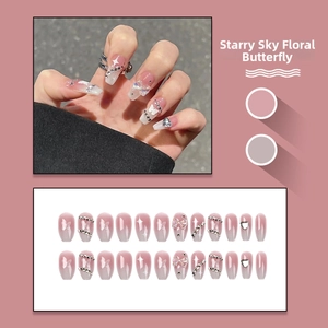 Detailed set of pink gradient press-on nails with 3D bows and silver rhinestone accents