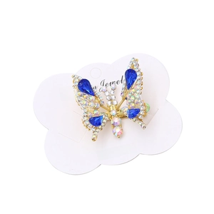 Elegant sparkling blue butterfly hair clip with rhinestones on a gold metal base