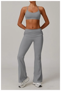 Detailed view of high-waist yoga flared pants with ruched waistband and matching sports bra
