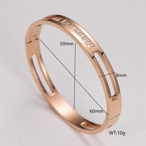 Macro detail of rose gold groove bangle showing 50x60mm inner diameter and zircon stones