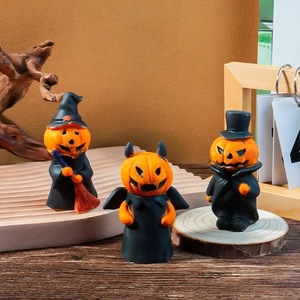 Three-piece Halloween pumpkin figurine set with witch, devil, and gentleman designs