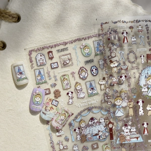 Detailed view of embossed cartoon dog and girl nail art stickers on a textured background