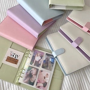 Detail showing 6-ring PU leather binder with transparent 4-slot inner sleeves for cards