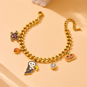 Halloween charm bracelet with pumpkin, reaper, and skull pendants in gold stainless steel