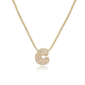 Detailed view of bubble letter C pendant with CZ stones on a gold box chain necklace