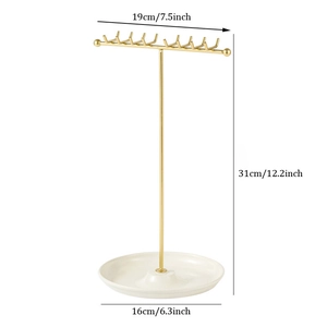 Golden T-bar jewelry stand with 16 hooks and ceramic tray base for necklace storage